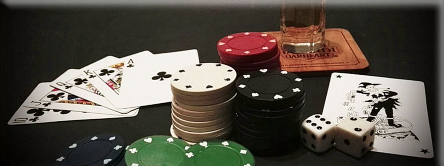 Online Casino Chips, dice and cards on the table